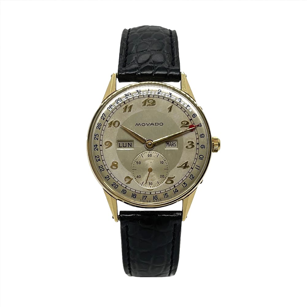 Montre vintage MOVADO Triple Date or 18k